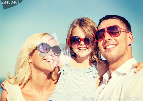 Image of happy family with blue sky