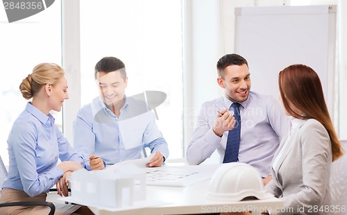 Image of happy team of architects and designers in office