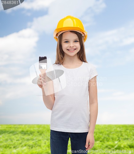 Image of smiling little girl in helmet with paint roller