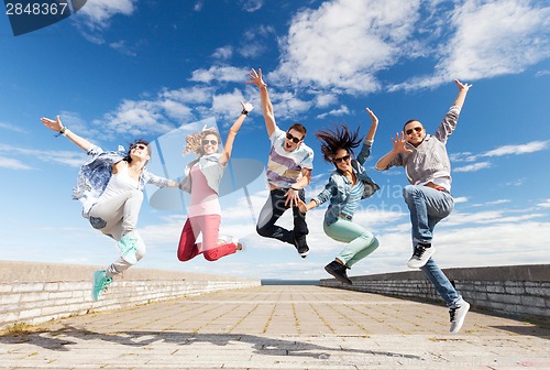 Image of group of teenagers jumping