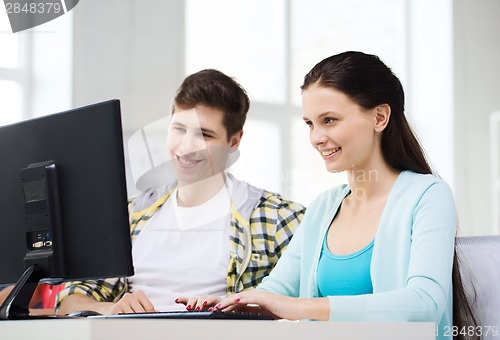 Image of two smiling students having discussion