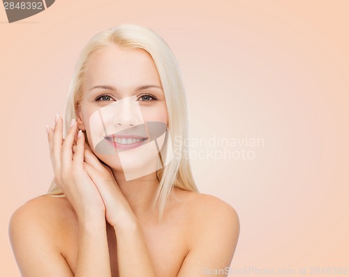 Image of face and hands of happy woman