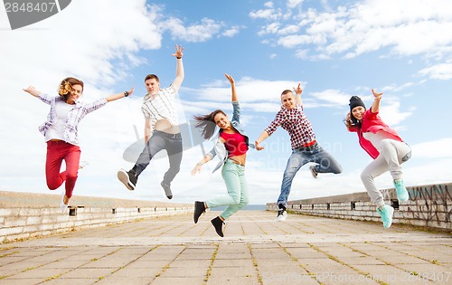 Image of group of teenagers jumping