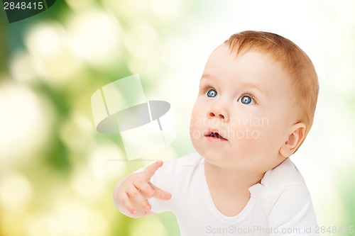 Image of curious baby looking up