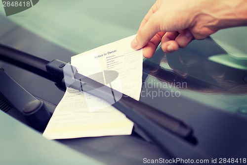 Image of parking ticket on car windscreen