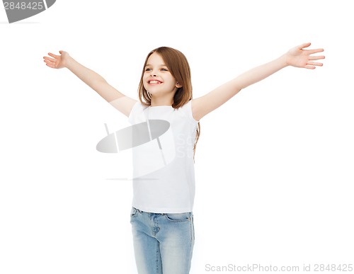 Image of smiling teenage girl with raised hands