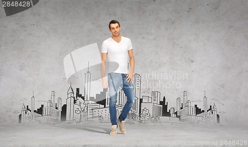 Image of smiling young man in white t-shirt