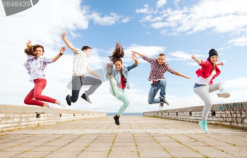 Image of group of teenagers jumping