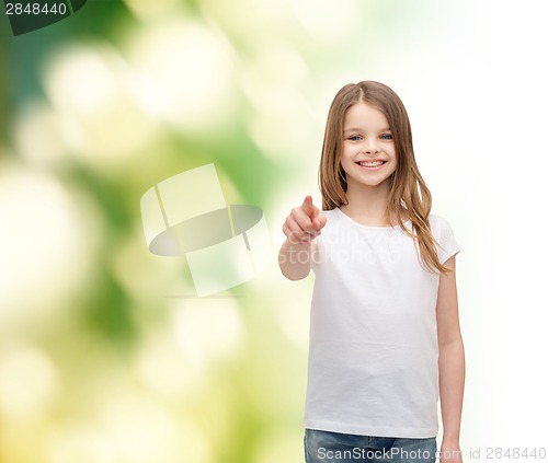 Image of little girl in blank white t-shirt pointing at you