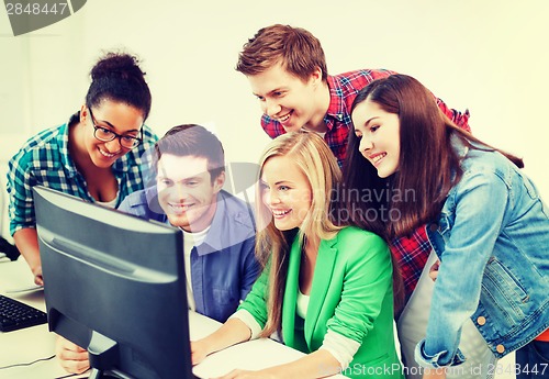 Image of students with computer studying at school