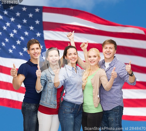 Image of group of smiling students showing thumbs up
