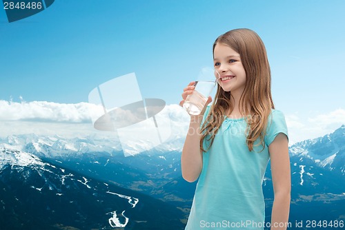 Image of smiling little girl with glass of water