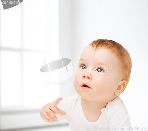 Image of curious baby looking up