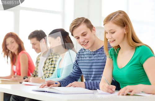 Image of students with textbooks and books at school