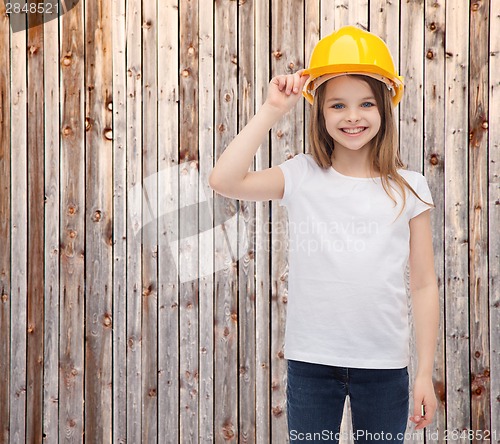 Image of smiling little girl in protective helmet