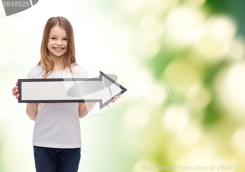 Image of smiling girl with blank arrow pointing right