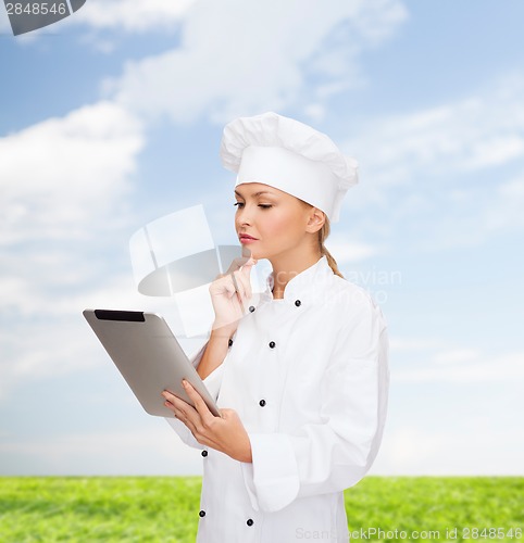 Image of smiling female chef with tablet pc computer