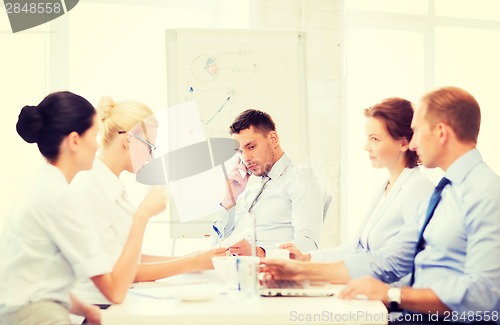 Image of stressed male boss on business meeting