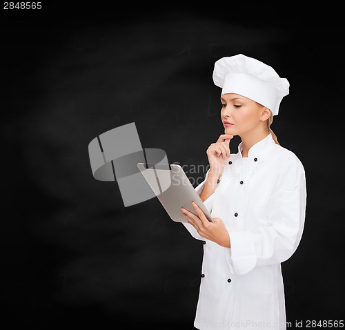 Image of smiling female chef with tablet pc computer