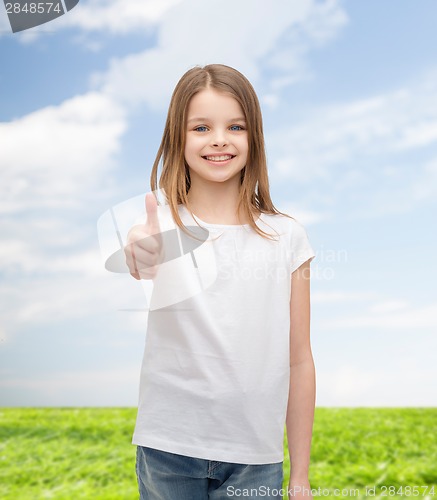 Image of girl in blank white t-shirt showing thumbs up