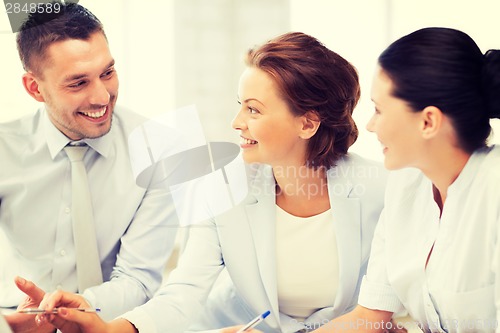Image of business team having discussion in office