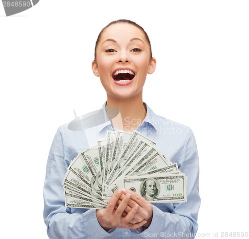 Image of young businesswoman with dollar cash money