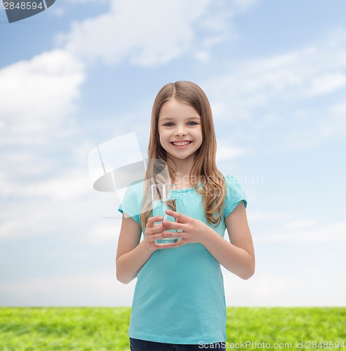 Image of smiling little girl with glass of water