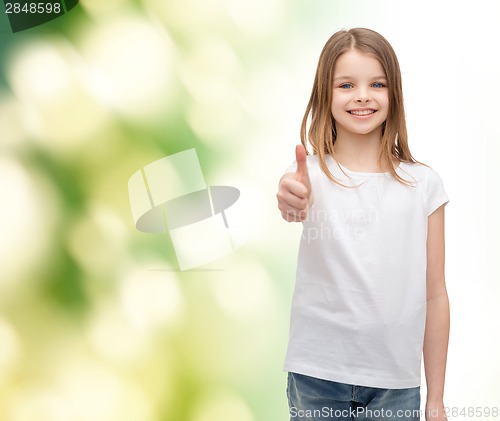 Image of girl in blank white t-shirt showing thumbs up