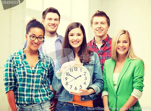 Image of group of students at school with clock