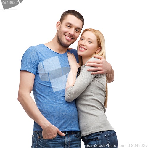 Image of smiling couple hugging