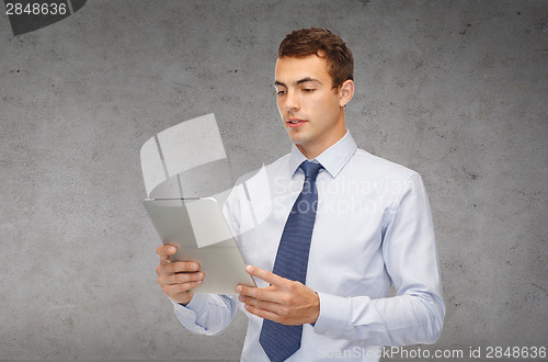 Image of businessman with tablet pc