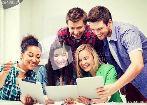 Image of students looking at tablet pc in lecture at school