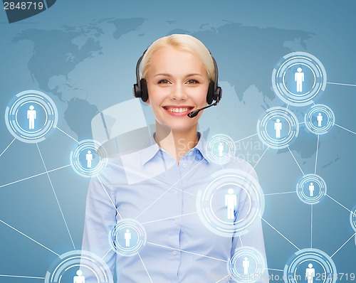 Image of friendly female helpline operator with headphones