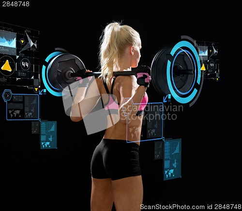 Image of sporty woman exercising with barbell from back