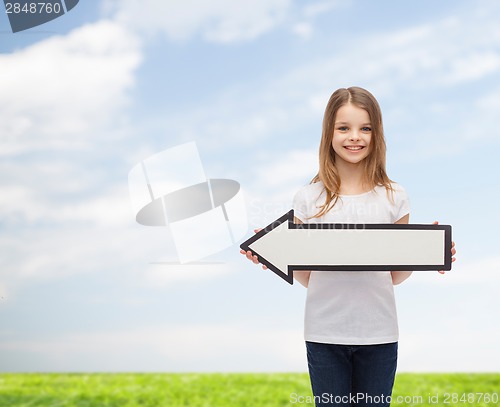 Image of smiling girl with blank arrow pointing left