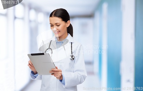 Image of female doctor with stethoscope and tablet pc
