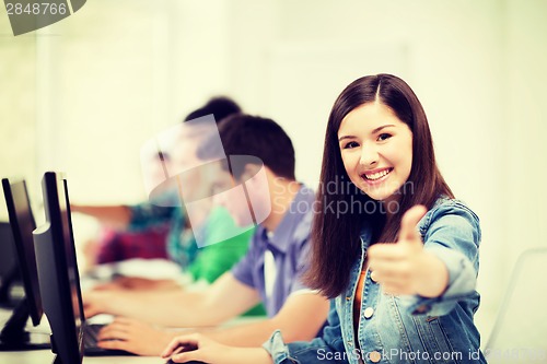 Image of student with computers studying at school