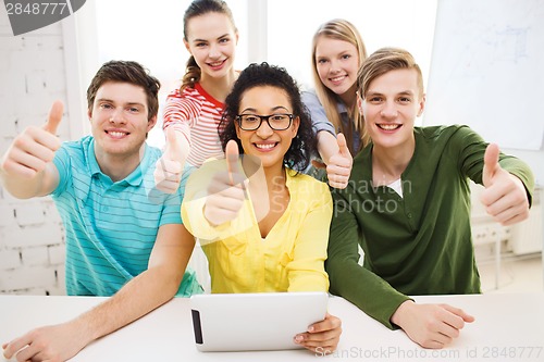 Image of smiling students with tablet pc computer at school