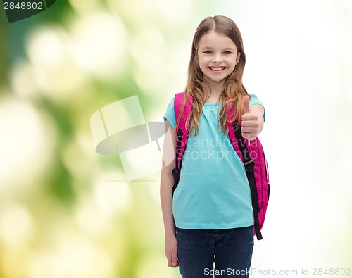 Image of smiling girl with school bag showing thumbs up
