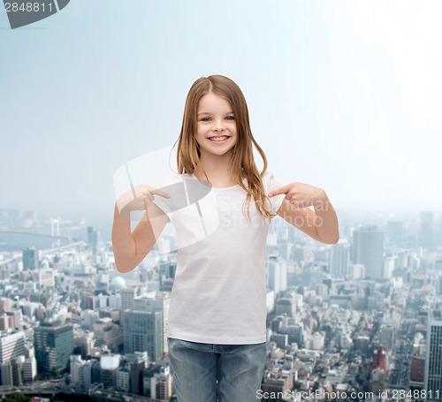 Image of smiling little girl in blank white t-shirt