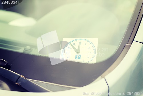 Image of parking clock on car dashboard