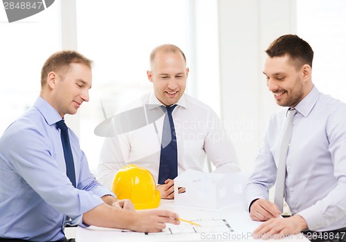 Image of happy team of architects and designers in office