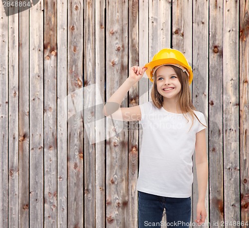 Image of smiling little girl in protective helmet