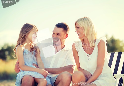 Image of happy family having a picnic