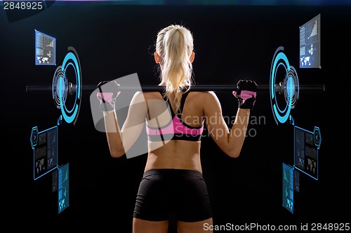 Image of sporty woman exercising with barbell