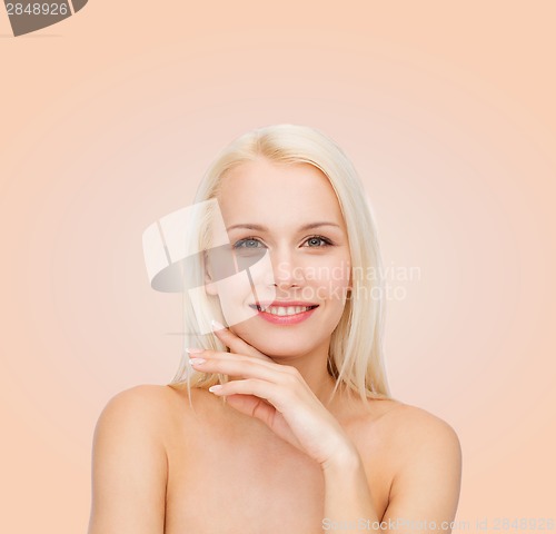 Image of face and hands of beautiful woman