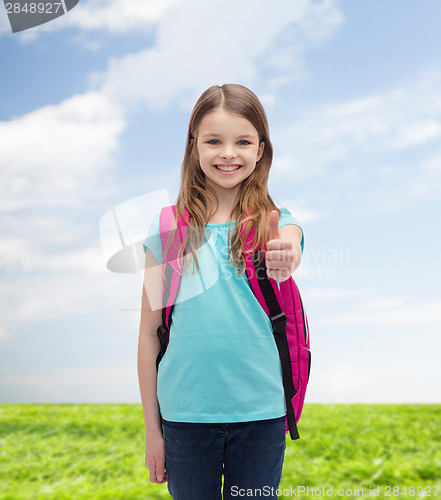Image of smiling girl with school bag showing thumbs up