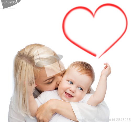 Image of happy mother kissing smiling baby