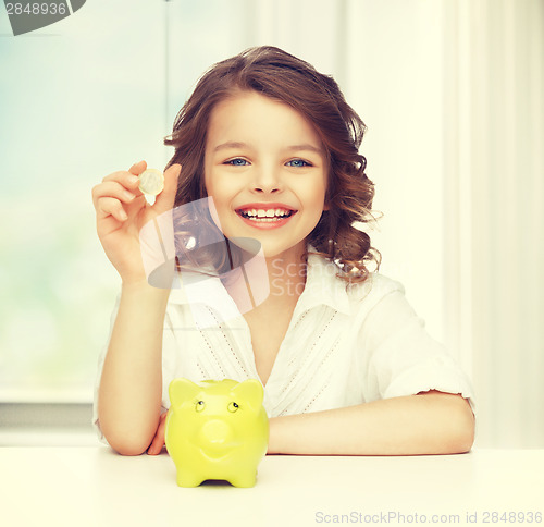 Image of girl with piggy bank