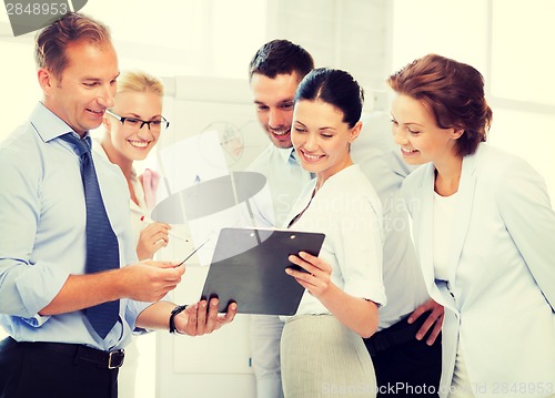 Image of business team discussing something in office